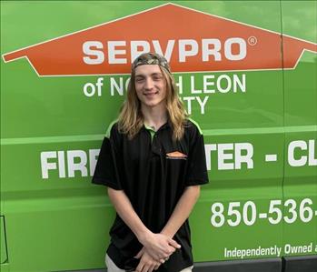 Andrew Willis standing in front of a SERVPRO® vehicle