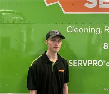 Picture of SERVPRO® crew member Ryan Mulkey standing in front of a SERVPRO vehicle