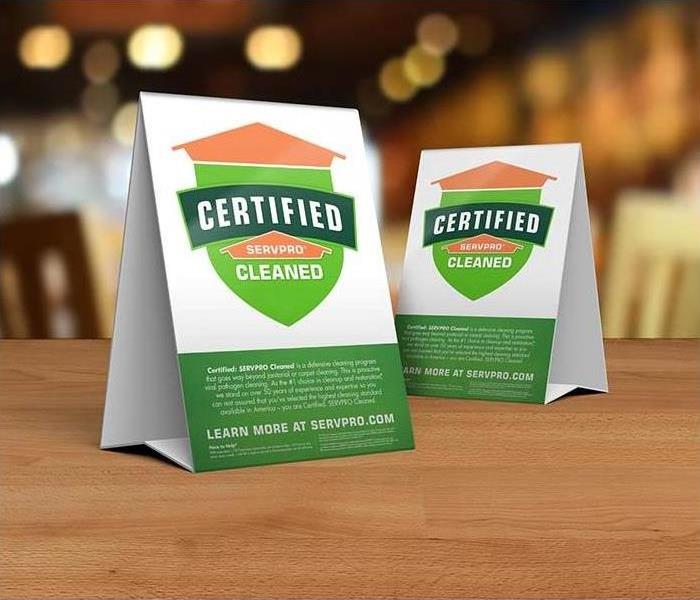 cleaning services - Certified: SERVPRO Cleaned decals on table